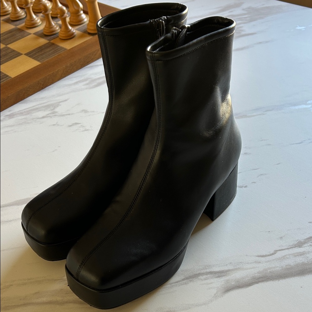 Jefferey Campbell black platform boots.